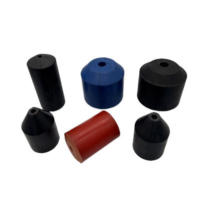 Assorted molded oil-saver rubber elements with central openings and varied profiles