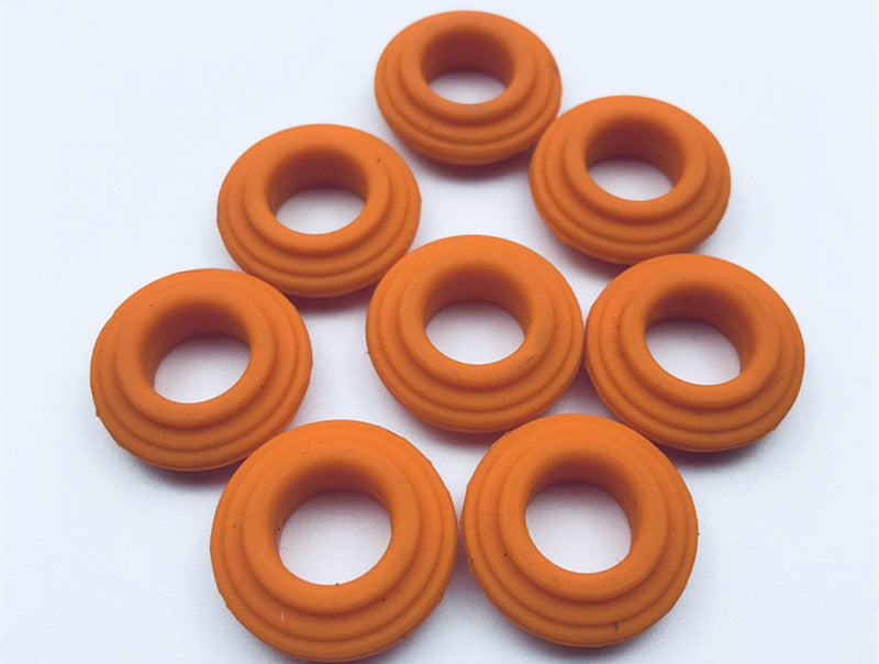 Orange molded rubber ring components with grooved annular profiles