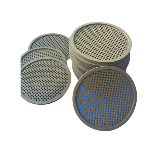 Stacked custom perforated rubber discs with square-hole patterns