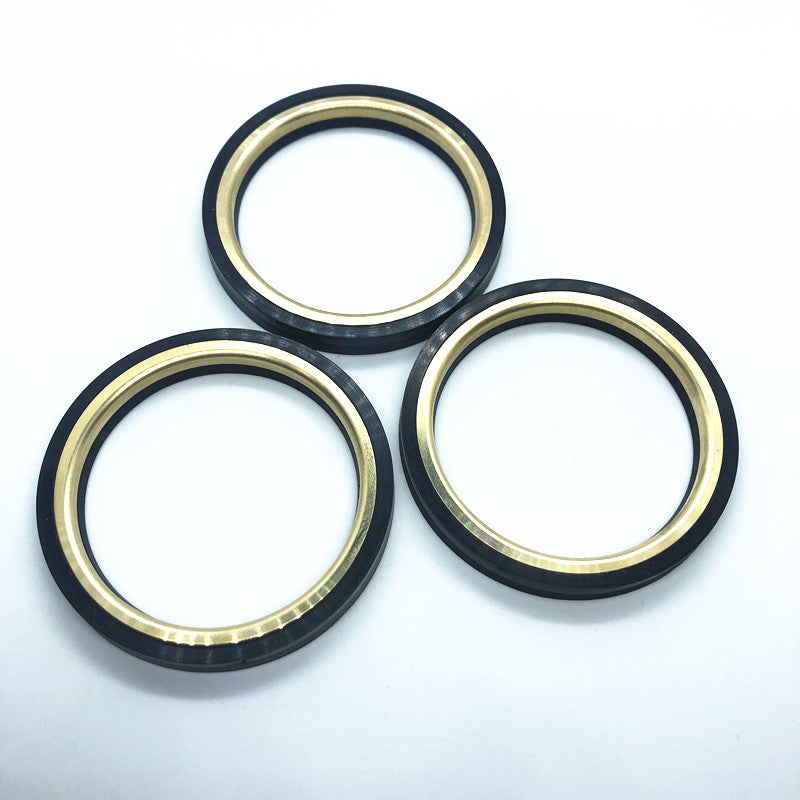 Plug-valve seal ring with metal backup