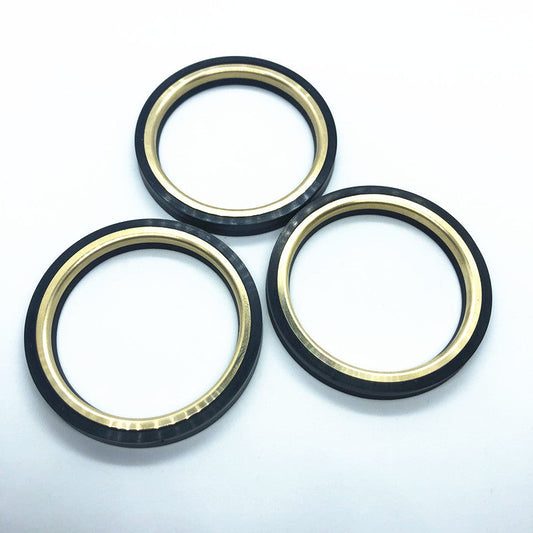 Plug-valve seal ring with metal backup