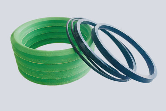 Black plunger pump wiper seals shown with green soft packing rings