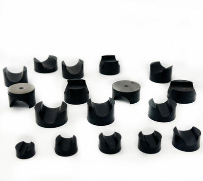 Black metal-bonded swivel ball retaining plugs in assorted sizes