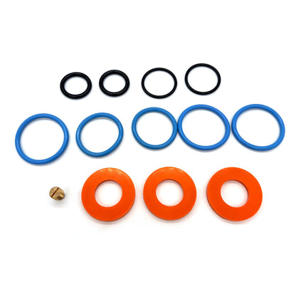 T Set redress kit components with orange washers, blue and black O-rings, and a threaded brass plug