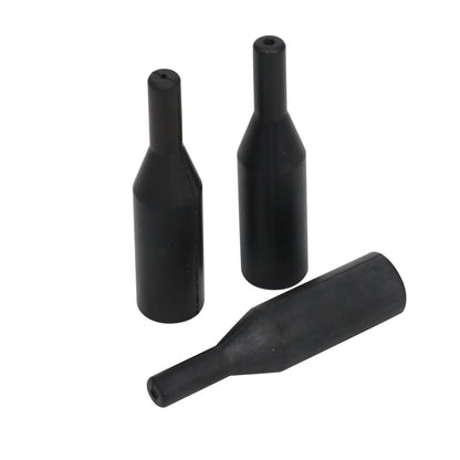 Three black tapered wireline oil saver rubber profiles with central line openings