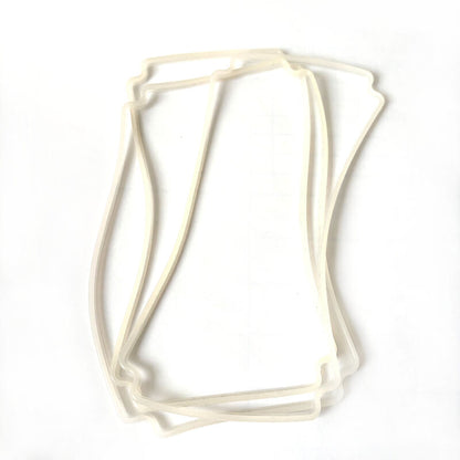 Three translucent molded rubber frame gaskets with contoured rectangular profiles