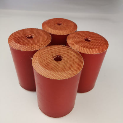 Red fabric-reinforced wireline oil saver rubber elements with center bores