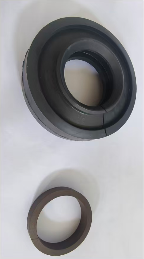 Stuffing box dome packing, 1-3/4 in black molded sealing component on a light background